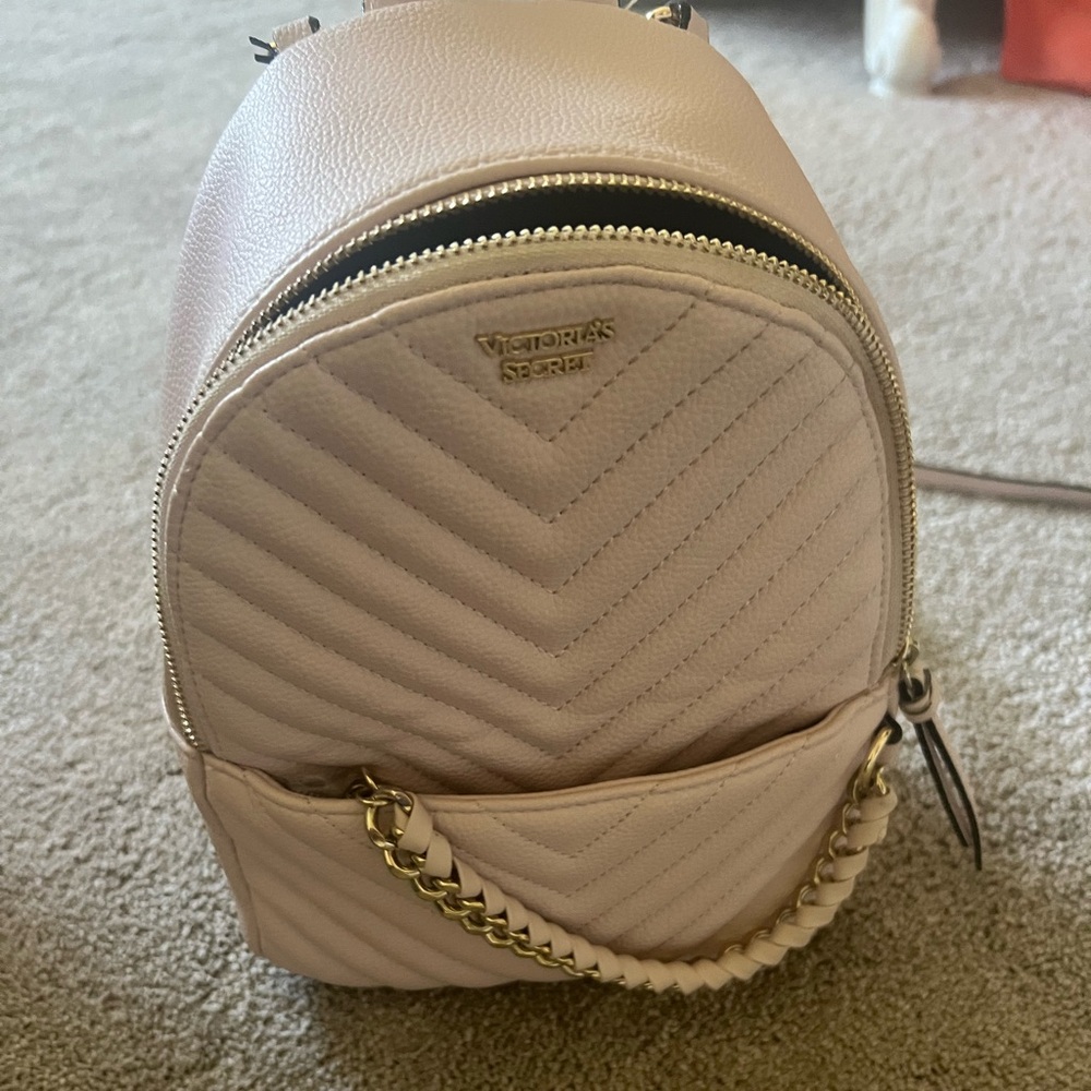 Victoria’s Secret mini backpack looks new cream color